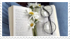 book with flowers and a pair of glasses